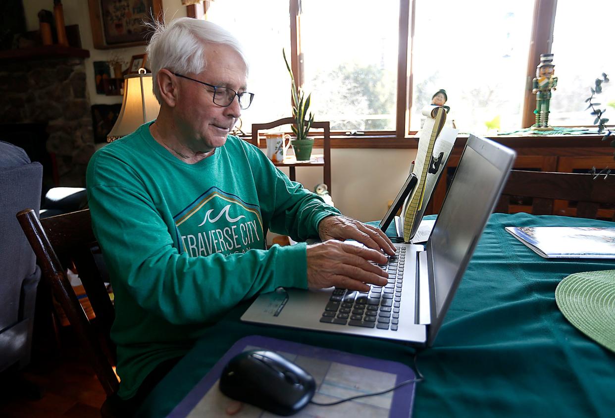 Jim Brewer works on a story for the Times-Shopper from his home on Tuesday, March 7, 2023. TOM E. PUSKAR/ASHLAND TIMES-GAZETTE