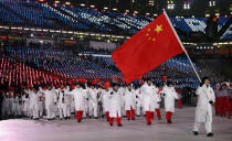 <p>Zhou Yang carries the flag of China during the opening ceremony of the 2018 Winter Olympics in Pyeongchang, South Korea, Friday, Feb. 9, 2018. (AP Photo/Jae C. Hong) </p>