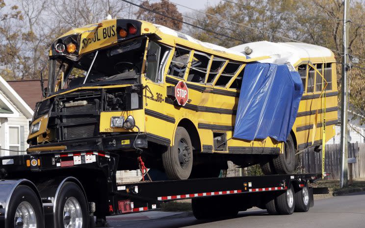 A school bus is carried away Tuesday, Nov. 22, 2016, in Chattanooga, Tenn, from the site where it crashed Monday, Nov. 21. (Photo: Mark Humphrey/AP)