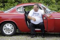 Irv Gordon laughs while being interviewed in his Volvo P1800 in Babylon, N.Y., Monday, July 2, 2012. Gordon's car already holds the world record for the highest recorded milage on a car and he is less than 40,000 miles away from passing three million miles on the Volvo. (AP Photo/Seth Wenig)