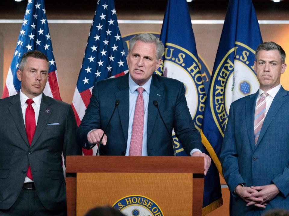 House Minority Leader Kevin McCarthy, R-Calif., speaks during a news conference as Rep. Jim Banks, R-Ind., right, looks on at Capitol Hill, in Washington, Wednesday, July 21, 2021. Pelosi is rejecting two Republicans tapped by House GOP Leader Kevin McCarthy to sit on a committee investigating the Jan. 6 Capitol insurrection. She cited the "integrity" of the investigation. (AP Photo/Jose Luis Magana)