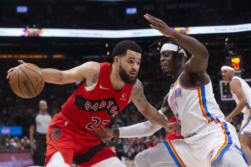Toronto Raptors' Fred VanVleet, left, drives at Oklahoma City Thunder's Luguentz Dort during the first half of an NBA basketball game Wednesday, Dec. 8, 2021, in Toronto. (Chris Young/The Canadian Press via AP)