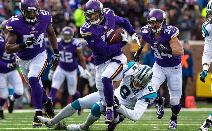 Minnesota Vikings wide receiver Adam Thielen returns a blocked punt for a touchdown during the first quarter against the Carolina Panthers.