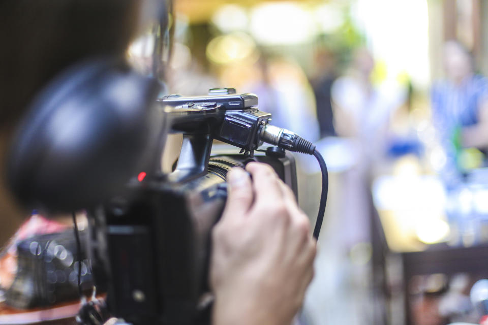 Closeup of someone operating a camera