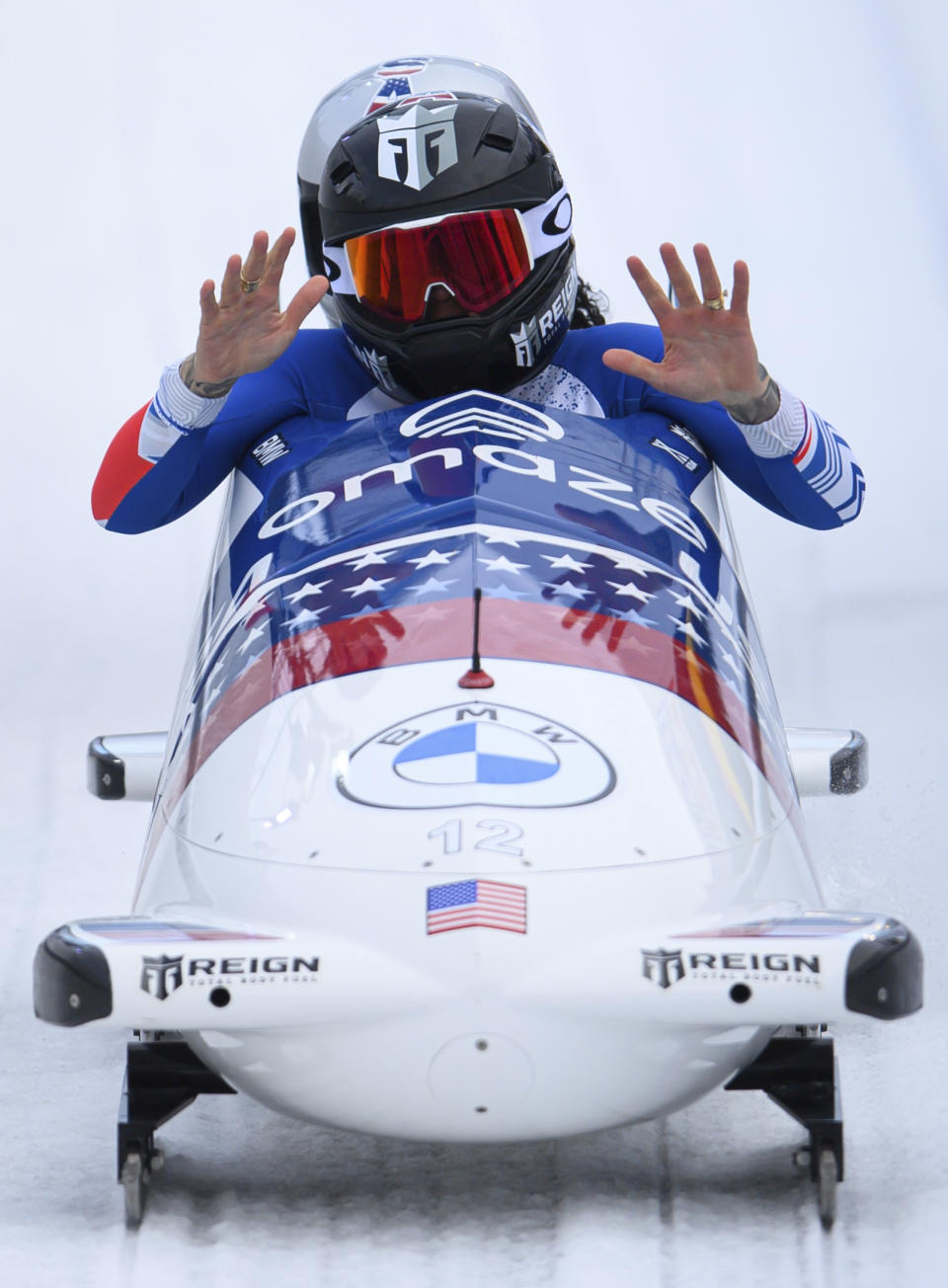 Kaillie Humphries and Kaysha Love from USA cross the finish line to win the two-seat bobsleigh world cup in Altenberg, Germany, Sunday, Dec. 5, 2021. (Robert Michael/dpa via AP)