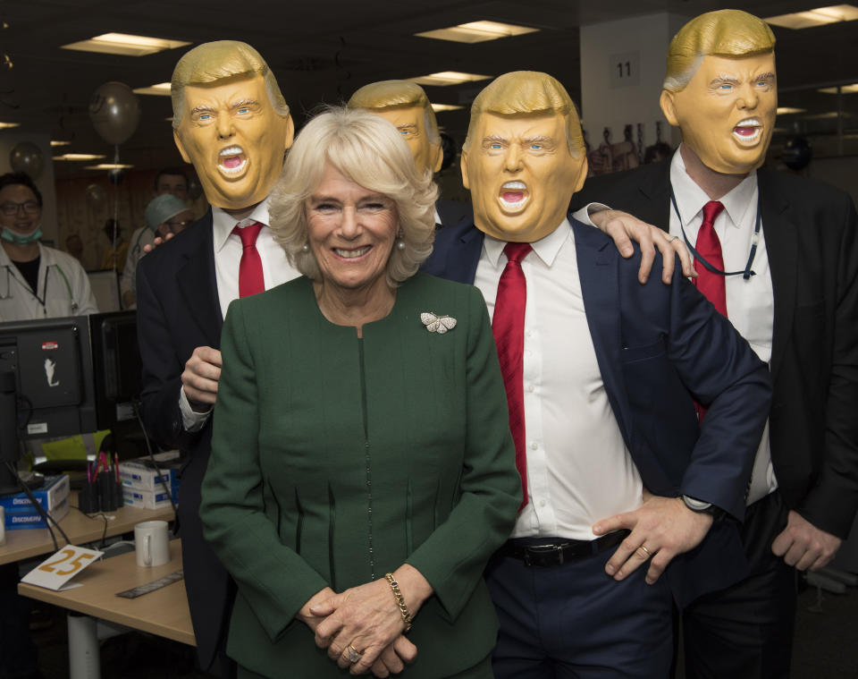 Camilla posed with several joke Trump heads at a charity event in 2017. Photo: Getty