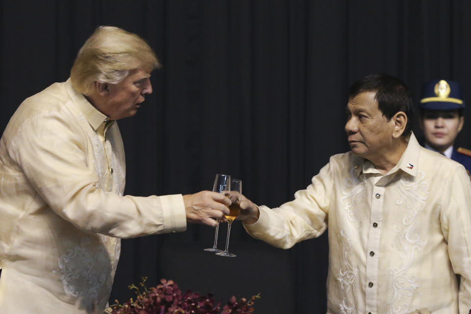 U.S. President Donald Trump toasts with Philippines President Rodrigo Duterte during the gala dinner marking ASEAN's 50th anniversary in Manila, Philippines, Sunday, Nov. 12, 2017. Nearly 5,000 drug suspects, mostly from the ranks of the poor, have been killed so far in reported clashes with police, and more than 155,000 others arrested in Duterte's so-called war on drugs. Trump praised the campaign in a phone call with Dutarte, telling him, “What a great job you are doing,” according to a leaked transcript of the call. (Athit Perawongmetha/Pool photo via AP, File)