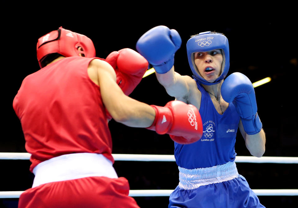 LONDON, ENGLAND - AUGUST 07: Michael Conlan of Ireland (R) in action with Nordine Oubaali of France during the Men's Fly (52kg) Boxing on Day 11 of the London 2012 Olympic Games at ExCeL on August 7, 2012 in London, England. (Photo by Scott Heavey/Getty Images)