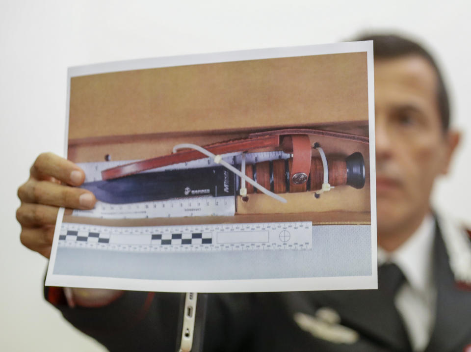 Carabinieri Colonel Lorenzo D'Aloia shows a picture of the knife used to stab Carabinieri's officer Mario Cerciello Rega, during a press conference in Rome, Tuesday, July 30, 2019. Two American teenagers were jailed in Rome on Saturday as authorities investigate their alleged roles in the fatal stabbing of the Italian police officer on a street near their hotel. (AP Photo/Andrew Medichini)