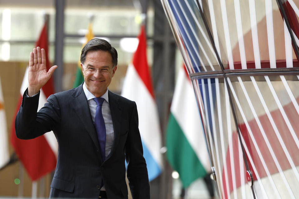 Netherland's Prime Minister Mark Rutte waves as he arrives for an EU summit in Brussels, Thursday, June 27, 2024. European Union leaders are expected on Thursday to discuss the next EU top jobs, as well as the situation in the Middle East and Ukraine, security and defence and EU competitiveness. (AP Photo/Geert Vanden Wijngaert)