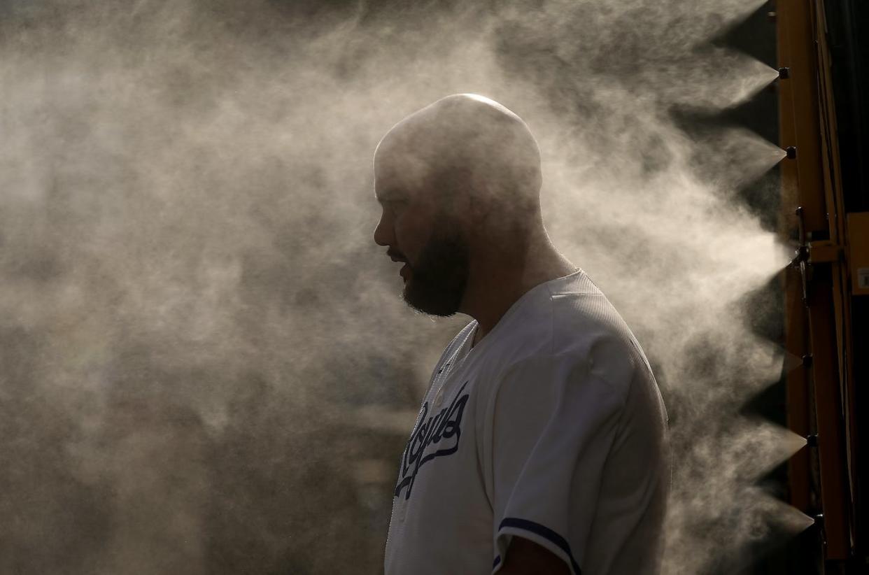 Kansas City's baseball stadium ran misters to cool people off in heat near 100 degrees on June 28, 2023. <a href="https://newsroom.ap.org/detail/HeatWaveMissouri/b3807c6f1e034556b1a829164b3f831d/photo" rel="nofollow noopener" target="_blank" data-ylk="slk:AP Photo/Charlie Riedel;elm:context_link;itc:0;sec:content-canvas" class="link ">AP Photo/Charlie Riedel</a>