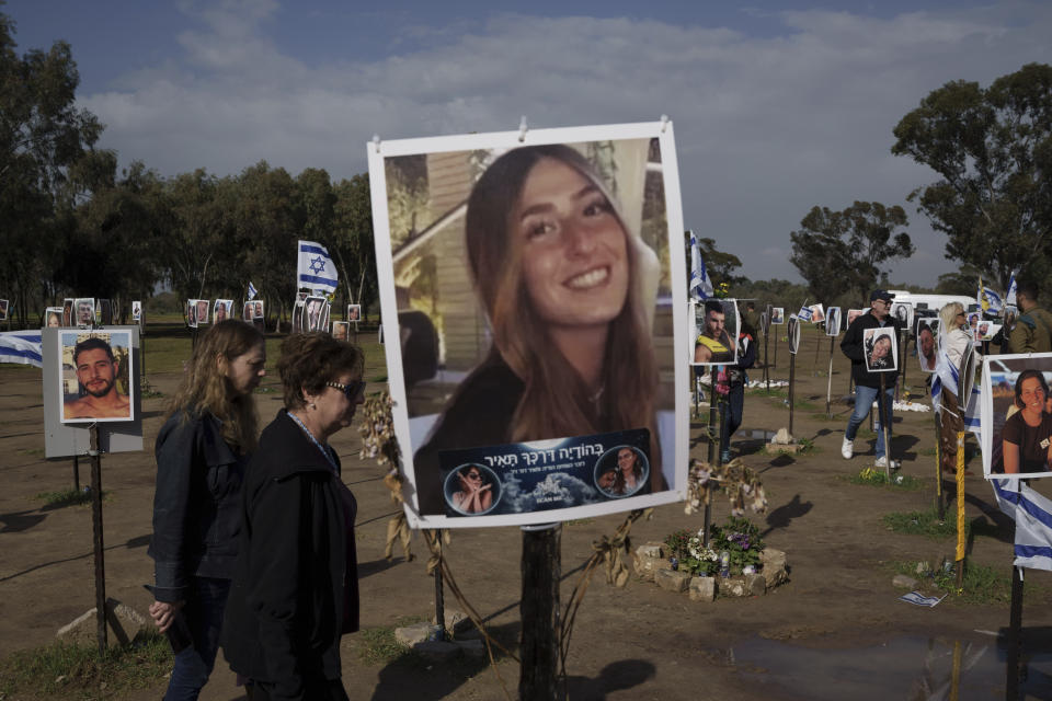 People visit the site where revelers were killed on Oct. 7 in a cross-border attack by Hamas at the Nova music festival in Re'im, southern Israel, Sunday, Jan. 14, 2024. Sunday marks 100 days of war between Israel and Hamas, after Hamas attacked Israel on Oct. 7th, killing some 1,200 people, mostly civilians, and taking 250 others hostage. In the Gaza Strip, health authorities say the death toll already has eclipsed 23,000 people. (AP Photo/Leo Correa)