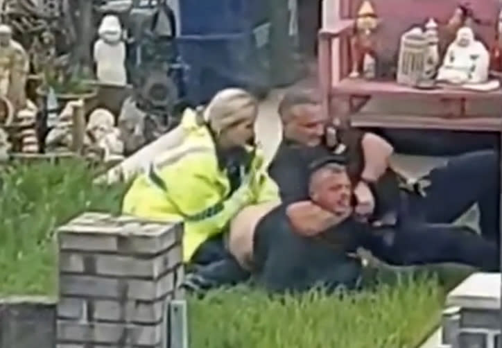 A police force is investigating after one its own officers was filmed repeatedly punching a man during an arrest. 

The suspect appeared to be placed in a choke hold around the neck before the officer delivered a series of blows to his face. 

As a female officer handcuffed the suspect he could be heard groaning in pain as shocked onlookers shouted at police. 

He was led to a police van with his eye and face visibly swollen following the arrest in Pothmadog, North Wales. 

North Wales Police said they were investigating the arrest. 


WALES NEWS SERVICE 


