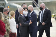 U.S. President Joe Biden is greeted by Rahm Emanuel, U.S. Ambassador to Japan upon his arrival at the U.S. Yokota Air Base, in Fussa on the outskirts of Tokyo, Sunday, May 22, 2022. (AP Photo/Eugene Hoshiko)