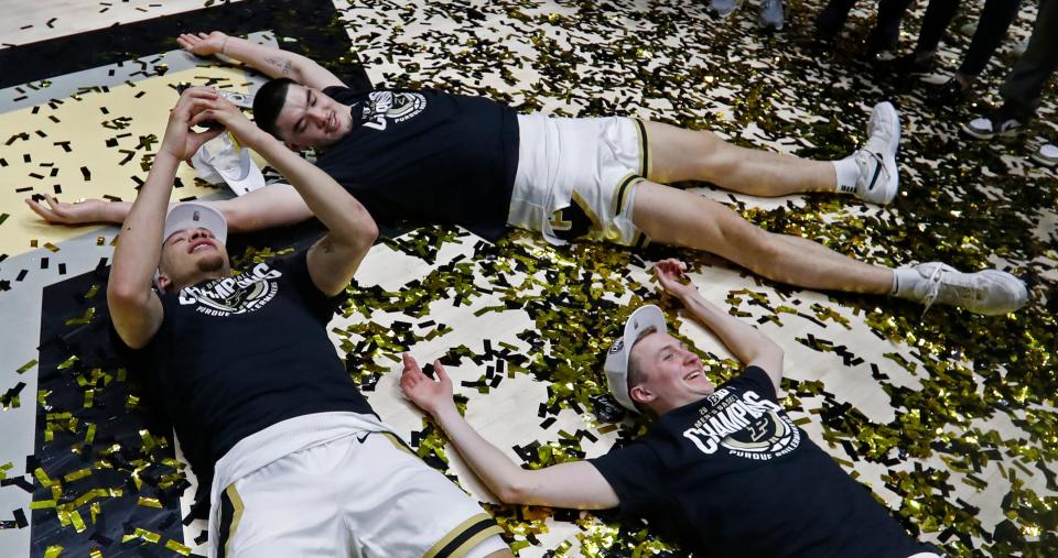 Purdue Boilermakers forward Mason Gillis (0), Purdue Boilermakers guard Fletcher Loyer (2) and Purdue Boilermakers center Zach Edey (15) celebrate after winning the Big Ten regular season championship during the NCAA men’s basketball game against the Michigan State Spartans, Saturday, March 2, 2024, at Mackey Arena in West Lafayette, Ind. Purdue Boilermakers 80-74.