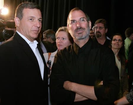 Steve Jobs (R) talks with Bob Iger at an Apple media event at the Yerba Buena Center of the Arts theater in San Francisco, California, September 12, 2006. REUTERS/Dino Vournas