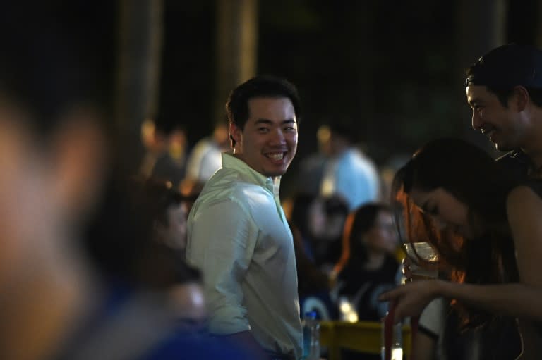 Aiyawatt Srivaddhanaprabha (C), son of Leicester City owner Vichai, attends a live televised viewing of the match between Leicester City and Swansea on April 24, 2016 in Bangkok