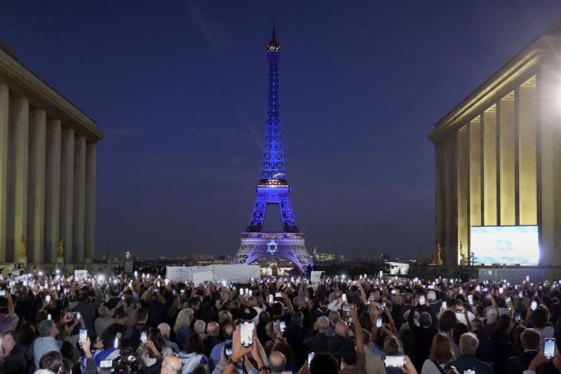 The Eiffel Tower is illuminated with the colors of the Israeli flag and its Star of David in support of the Jewish State in Paris, on Monday. The tower was illuminated after a demonstration in support for Israel in the aftermath of Hamas Islamic group's devastating surprise attack from Gaza. Photo by Maya Vidon-White/UPI