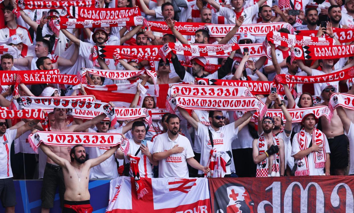 <span>Fans of Georgia at the Euro 2024 group stage match against Turkey in Dortmund, Germany, on Tuesday.</span><span>Photograph: Dean Mouhtaropoulos/Getty Images</span>