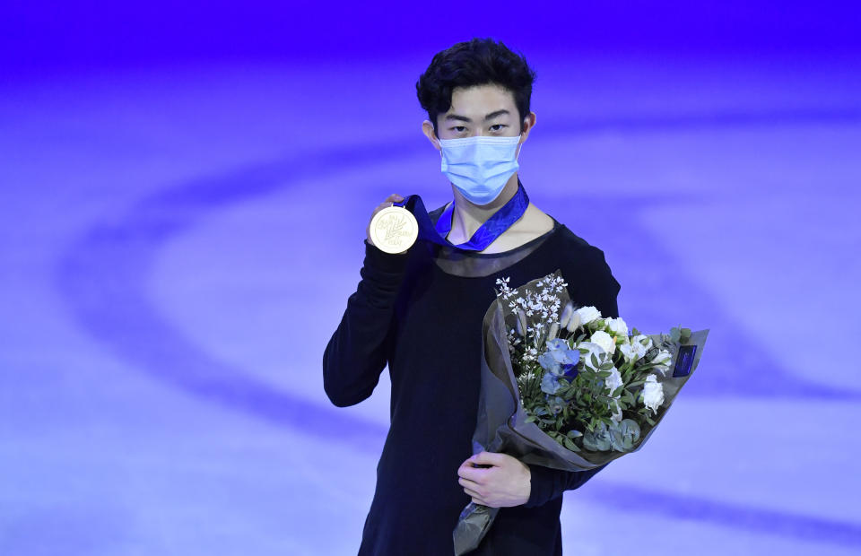 Nathan Chen of the USA stands on the podium after winning the gold medal during the Men Free Skating Program at the Figure Skating World Championships in Stockholm, Sweden, Saturday, March 27, 2021. (AP Photo/Martin Meissner)