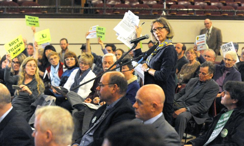 Cape Downwind spokesperson Diane Turco addresses the NRC meeting in Plymouth in March 2017. Representatives from Entergy Corp. are in the foreground. Ron Schloerb/Cape Cod Times