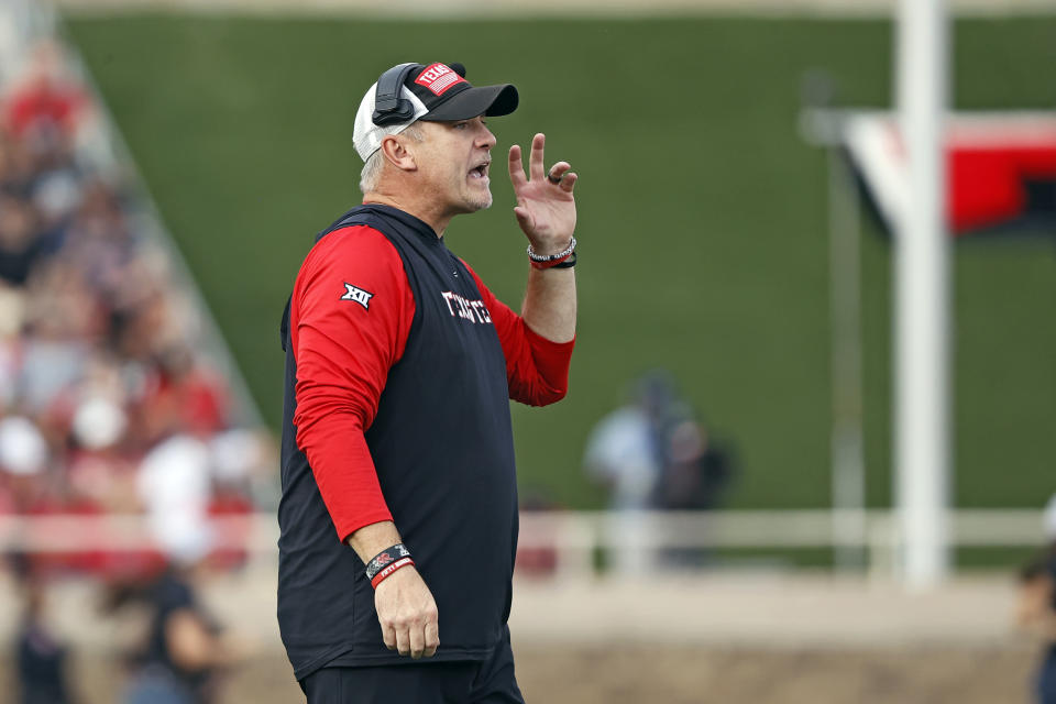 Texas Tech coach Joey McGuire yells out to his players during the second half of an NCAA college football game against West Virginia, Saturday, Oct. 22, 2022, in Lubbock, Texas. (AP Photo/Brad Tollefson)