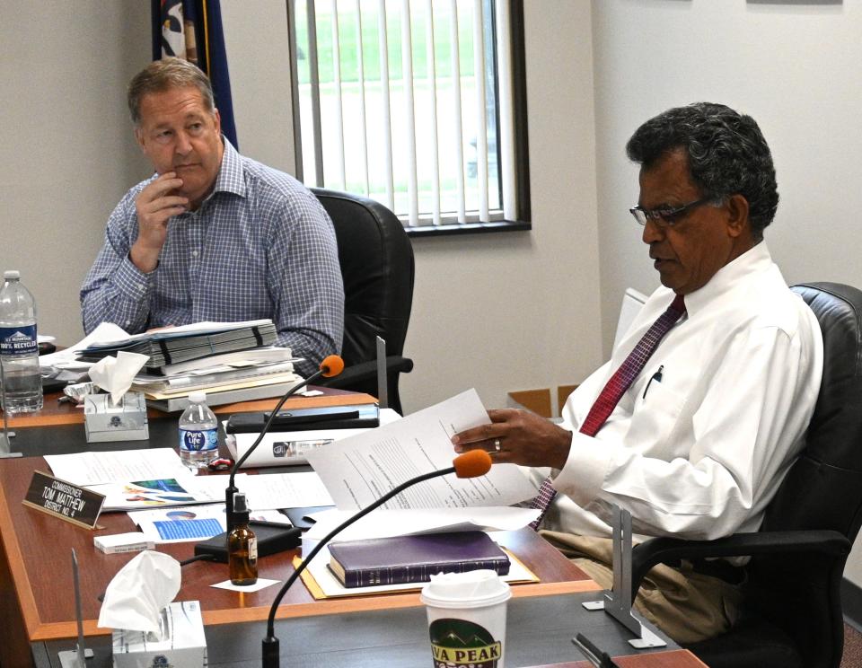 Administrator Bud Norman looks on as commissioner Tom Matthew questioned Maple Lawn finances during the Thursday work session.