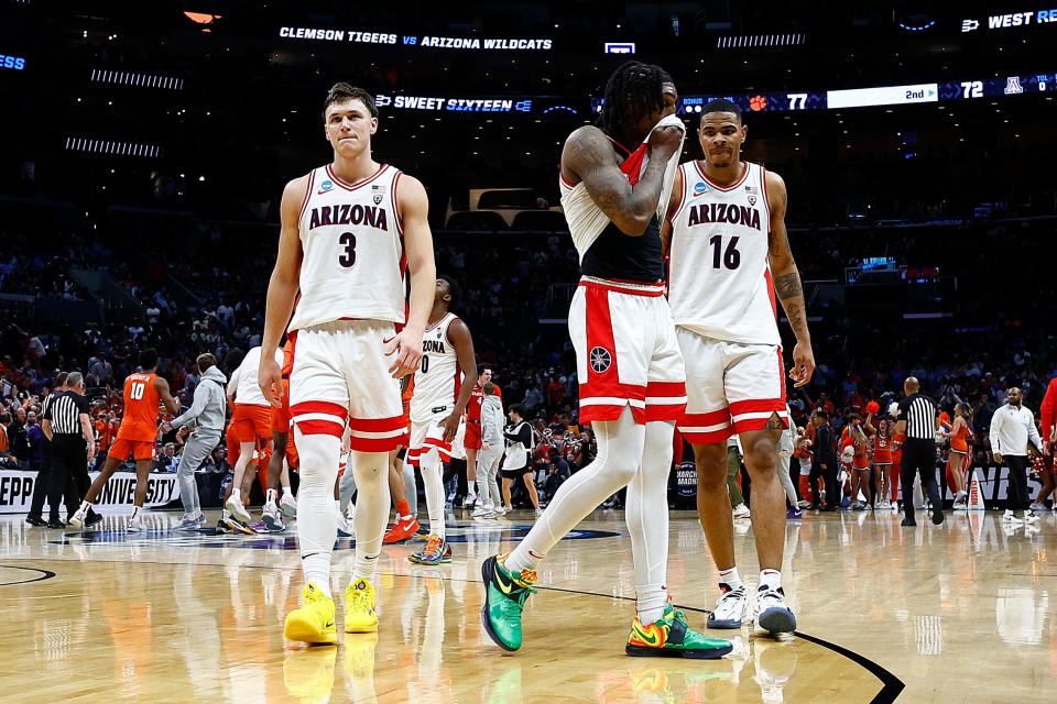 Caleb Love #2, Pelle Larsson #3 and Keshad Johnson #16 of the Arizona Wildcats reacts after losing to the Clemson Tigers during the second half in the Sweet 16 round of the NCAA Men's Basketball Tournament at Crypto.com Arena on March 28, 2024 in Los Angeles, California. The Clemson Tigers won, 77-72.