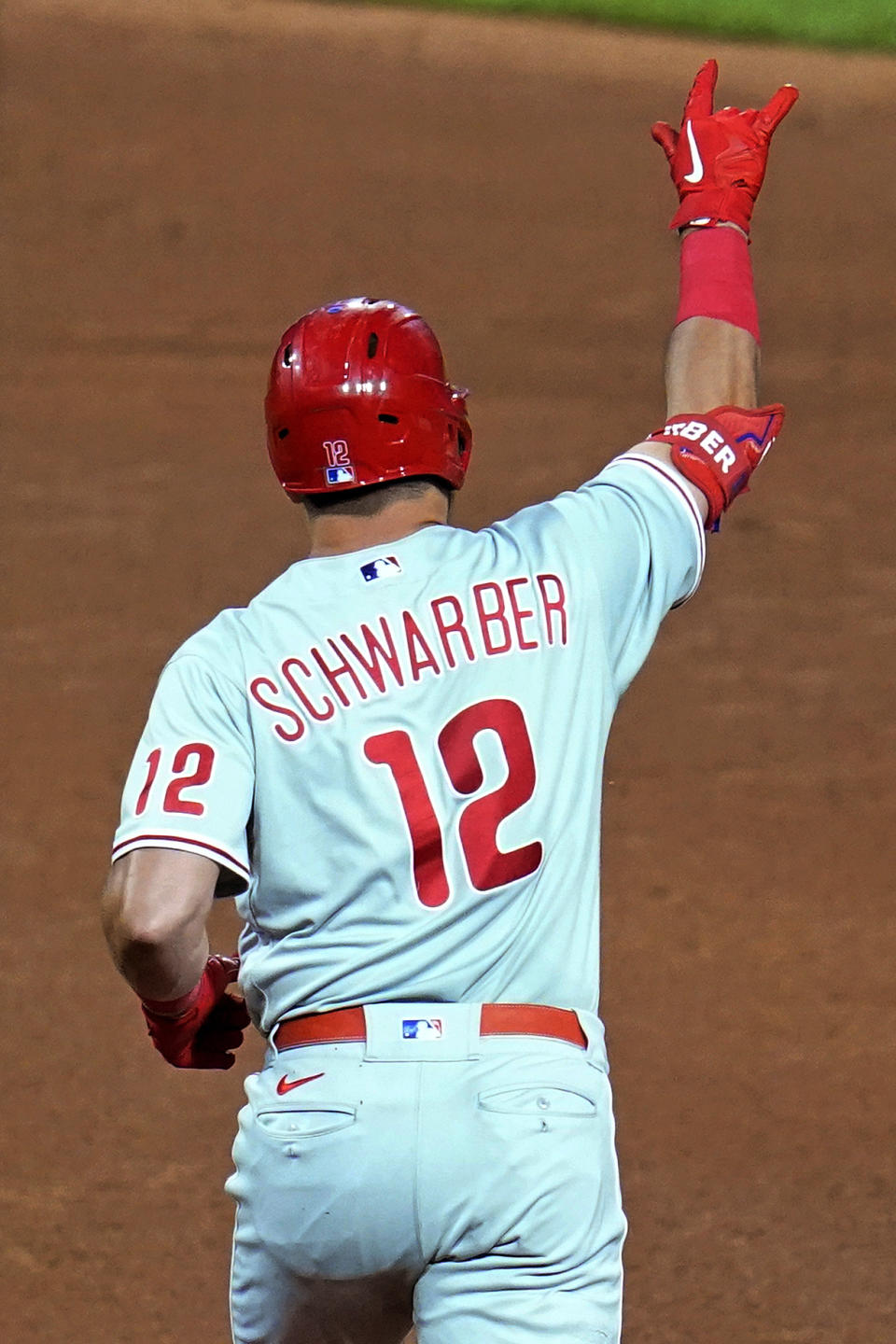 Philadelphia Phillies' Kyle Schwarber celebrates as he runs the bases on a three-run home run off Pittsburgh Pirates starting pitcher Zach Thompson during the sixth inning of a baseball game in Pittsburgh, Thursday, July 28, 2022. (AP Photo/Gene J. Puskar)