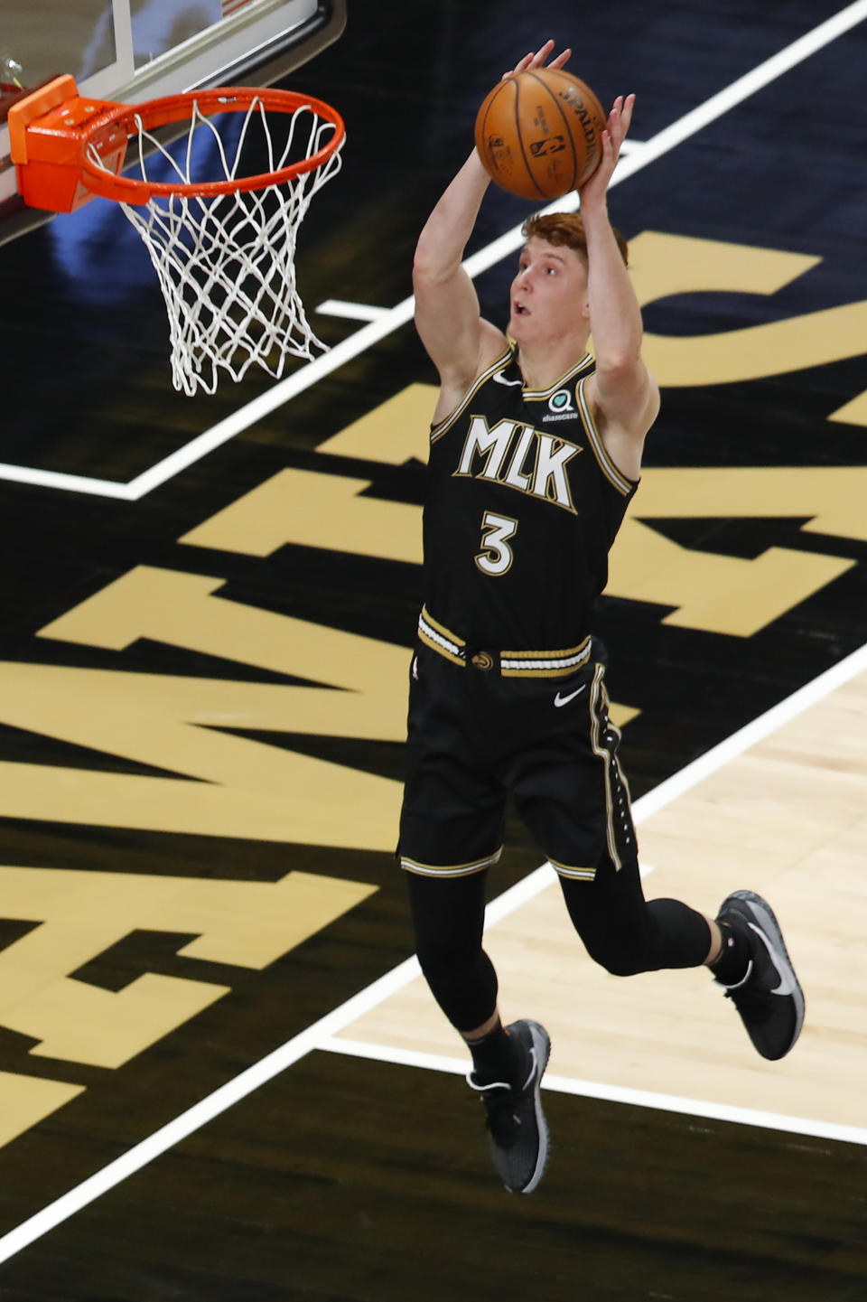 Atlanta Hawks guard Kevin Huerter (3) goes up for a shot in the first half of an NBA basketball game against the Minnesota Timberwolves on Monday, Jan. 18, 2021, in Atlanta. (AP Photo/Todd Kirkland)
