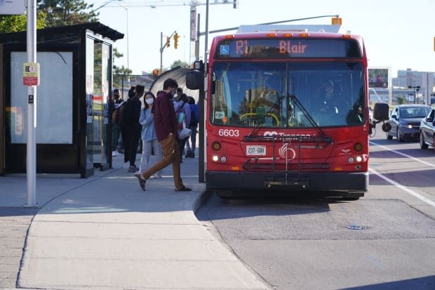 People board an OC Transpo bus on Sept. 20, 2021 during the fourth wave of the COVID-19 pandemic. Ontario's vaccine passport will not be required on public transit. (Francis Ferland/CBC - image credit)