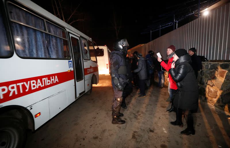 Buses transporting evacuees from coronavirus-hit China drive in Poltava region