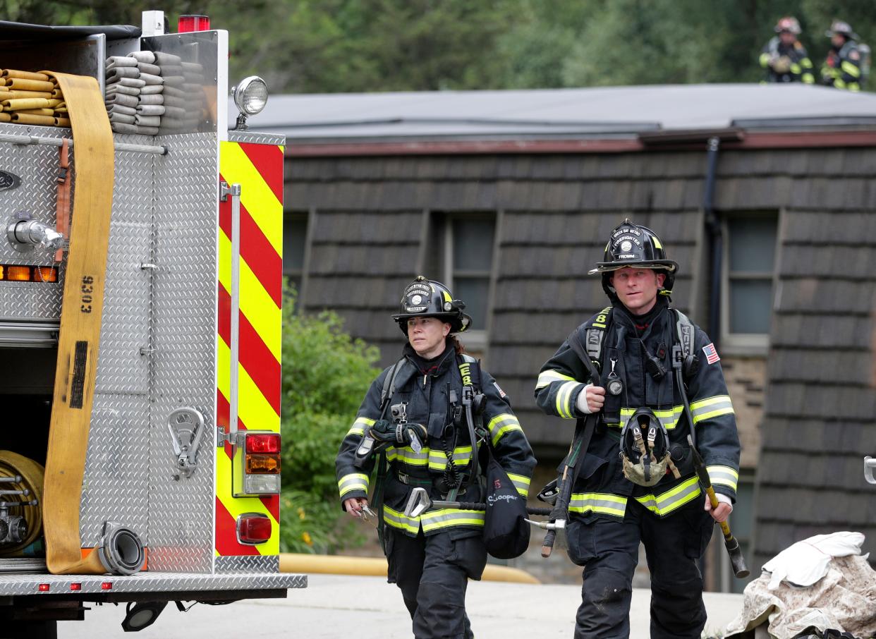 Firefighters outside of Crow's Nest Apartments on North Broadway after a fire was reported in one of the units on June 29, 2022, in De Pere, Wis.