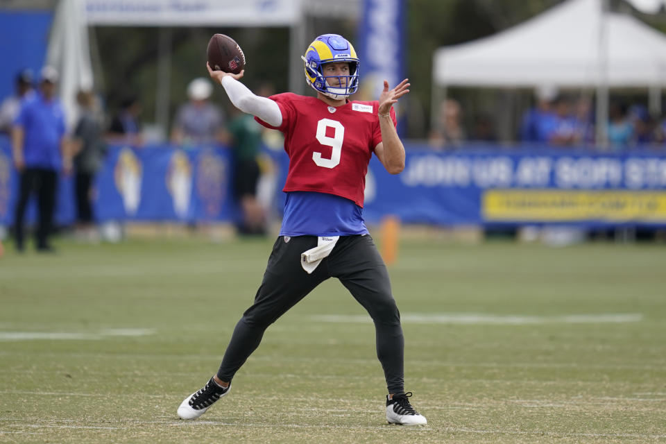 Los Angeles Rams quarterback Matthew Stafford (9) participates in drills at the NFL football team's practice facility in Irvine, Calif. Thursday, Aug. 4, 2022. (AP Photo/Ashley Landis)