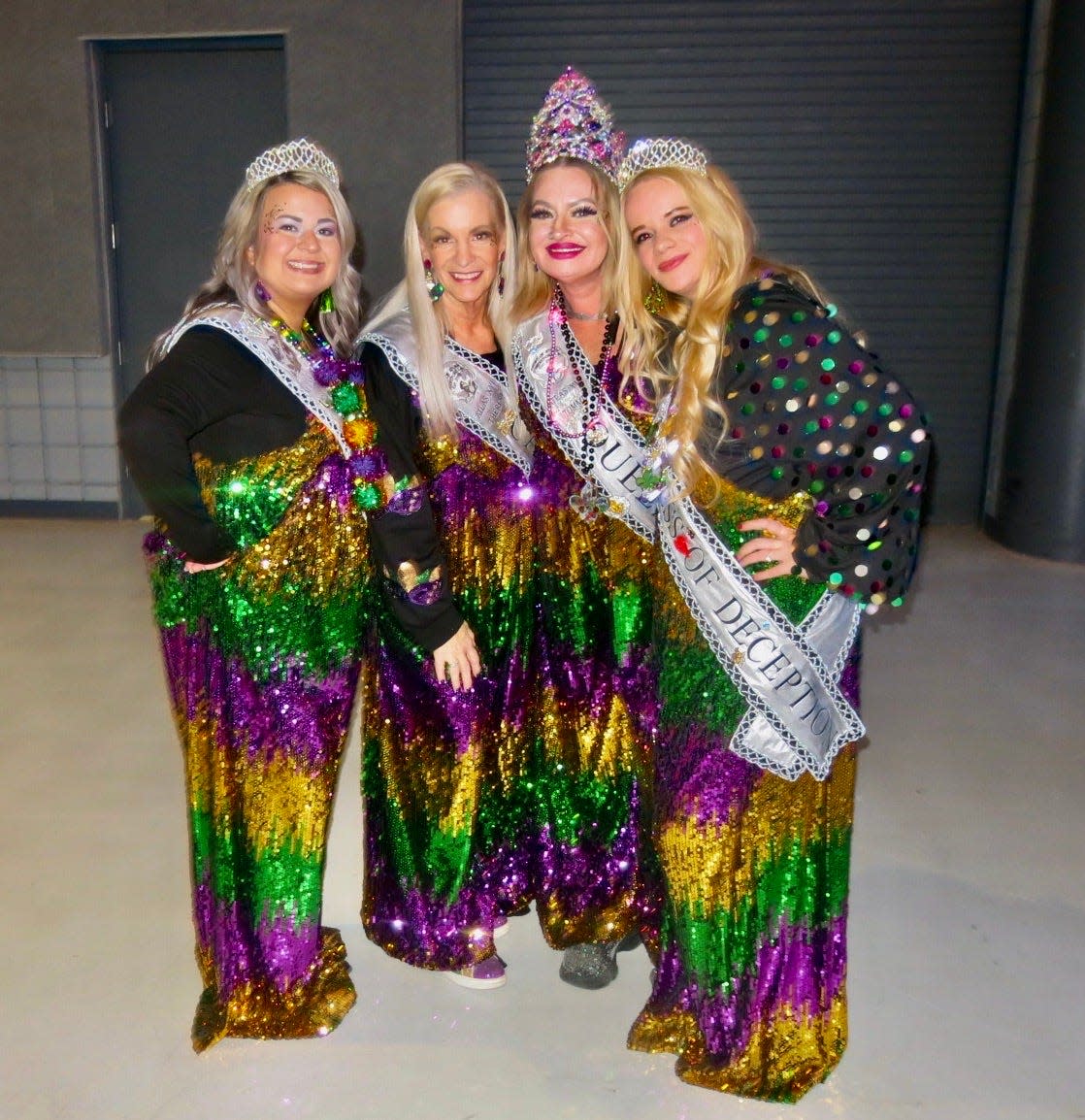 Krewe of Atlas XVI Duchess Ashley Bodie, Captain Theresa Miller, Queen Tommi Johnson and Duchess Brittany Johnson show of their matching Mardi Gras outfits at the Twelfth Night Party.