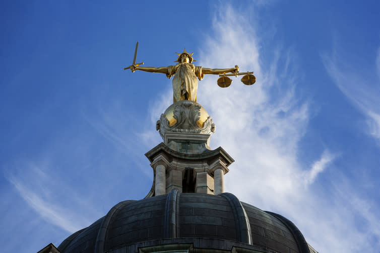 <span class="caption">Blind justice for a AI.</span> <span class="attribution"><a class="link " href="https://www.shutterstock.com/image-photo/gold-lady-justice-statue-on-top-127526276?src=DFZSKGdRwUVTwgeyFSiT0w-1-25" rel="nofollow noopener" target="_blank" data-ylk="slk:Shutterstock;elm:context_link;itc:0;sec:content-canvas">Shutterstock</a></span>