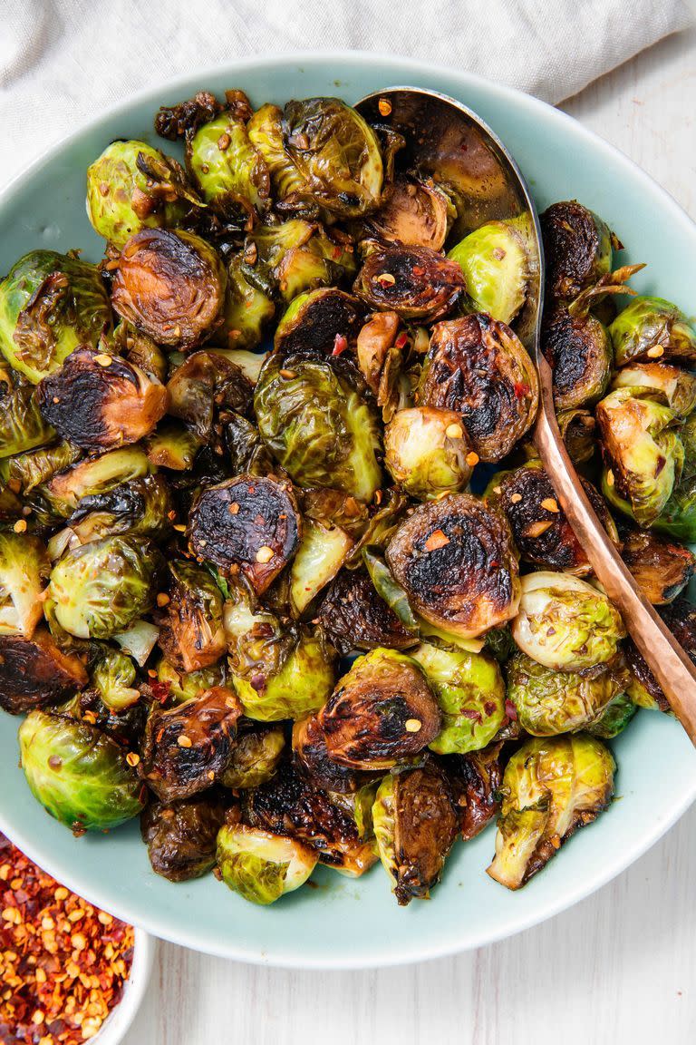 <p>The hardest part of making these Brussels sprouts is leaving them alone. If you want that nice golden caramelisation, you gotta let those little guys cook undisturbed. </p><p>Get the <a href="https://www.delish.com/uk/cooking/recipes/a28934268/honey-balsamic-glazed-brussels-sprouts-recipe/" rel="nofollow noopener" target="_blank" data-ylk="slk:Honey Balsamic Glazed Brussels Sprouts;elm:context_link;itc:0;sec:content-canvas" class="link ">Honey Balsamic Glazed Brussels Sprouts</a> recipe.</p>