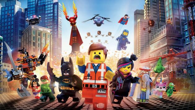 lego characters run in a panic in the poster for the lego movie