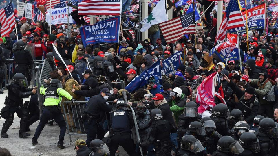PHOTO: Trump supporters clash with police and security forces as they push barricades to storm the US Capitol in Washington D.C, Jan. 6, 2021.  (Roberto Schmidt/AFP via Getty Images)