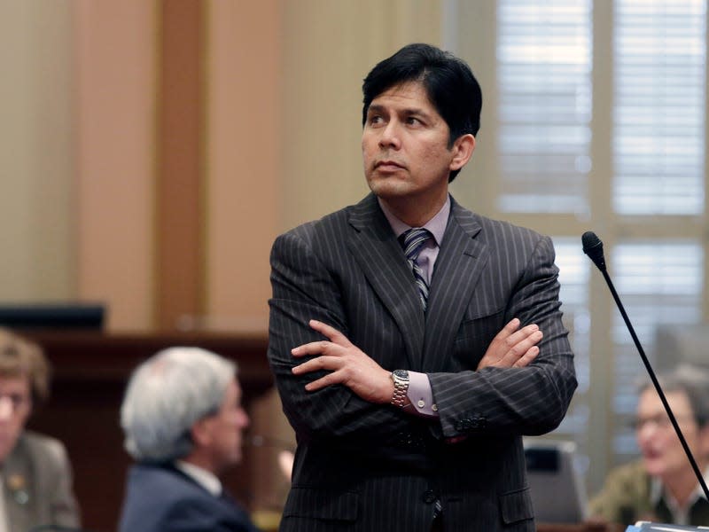  State Sen. Kevin de Leon, D-Los Angeles, watches as the votes are posted for his measure that would at the Capitol in Sacramento, Calif. De Leon will be sworn-in as the new Senate leader at a lavish evening event, with far more pomp than the typical Capitol affair that marks the change leadership, at the Walt Disney Concert Hall, in Los Angeles, Wednesday, Oct. 15, 2014.