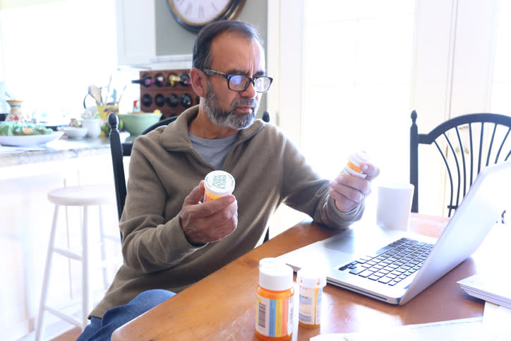 A man looking at how much money he has in his health savings account (HSA) to pay for medical expenses. 