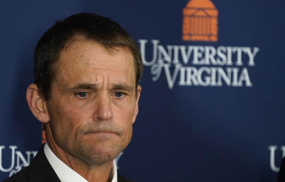 University of Virginia President Jim Ryan listens during a news conference, Monday, Nov. 14, 2022, in Charlottesville. Va. A University of Virginia student was taken into custody Monday after fatally shooting three members of the school’s football team as they were returning to campus Sunday night from a field trip, officials said. (AP Photo/Steve Helber)