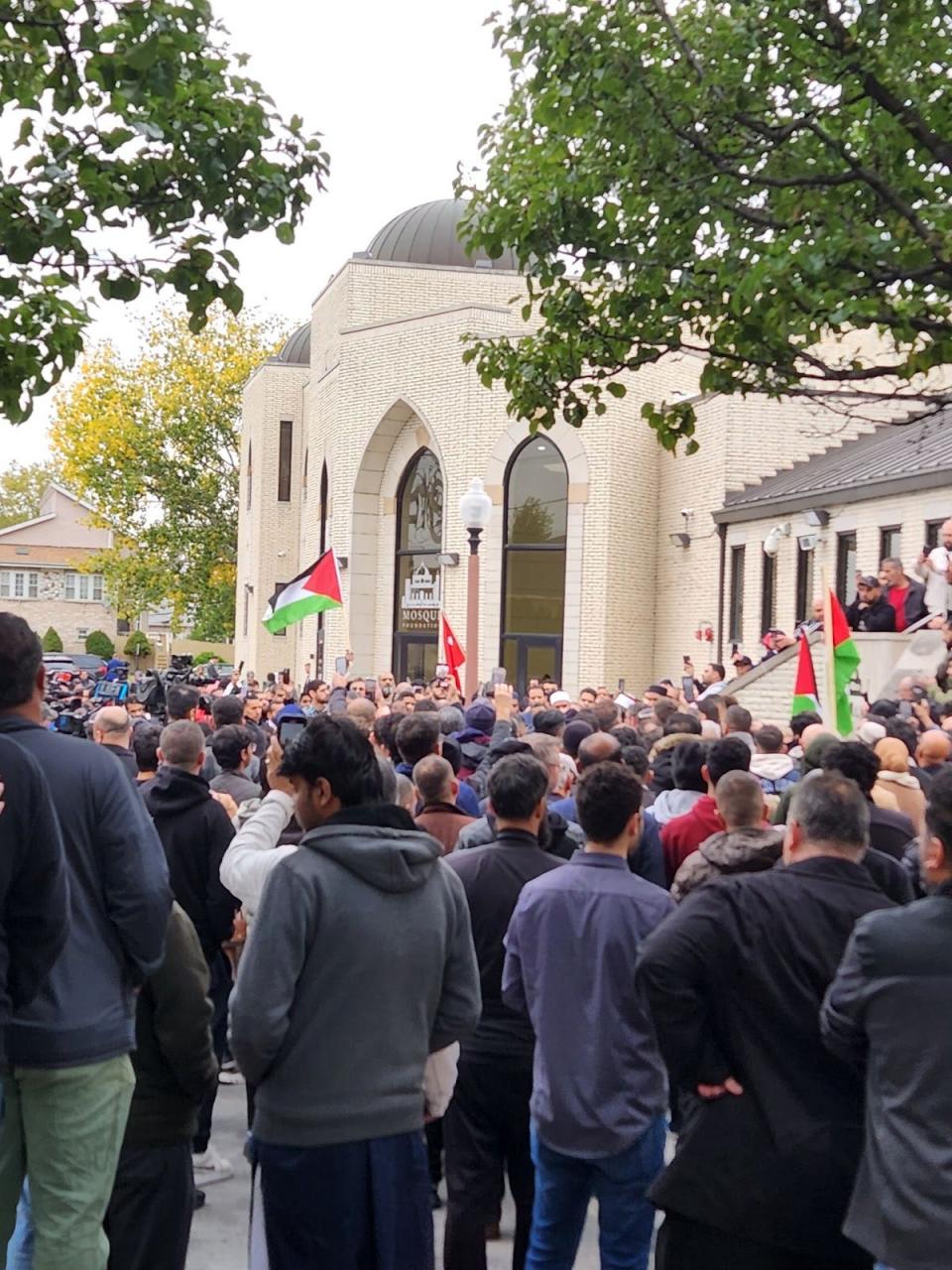 Mourners gather outside the funeral of Wadea Al-Fayoume, a 6-year-old who was stabbed to death in a Chicago suburb. suspect has been charged with a hate crime, with authorities saying he was killed in a violent response to the Israel-Hamas war.