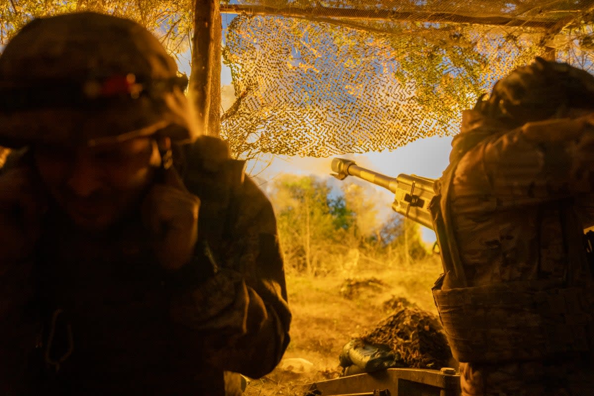 Ukrainian soldiers fire towards Russian positions near the frontline  (AP)