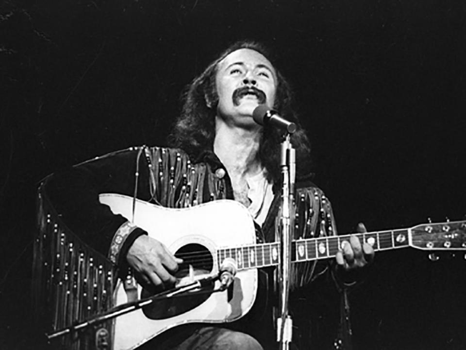 David Crosby, of the group Crosby, Stills, Nash & Young, performs at Olympia Stadium on June 12, 1970 in Detroit.  / Credit: Tom Copi/Michael Ochs Archives/Getty Images