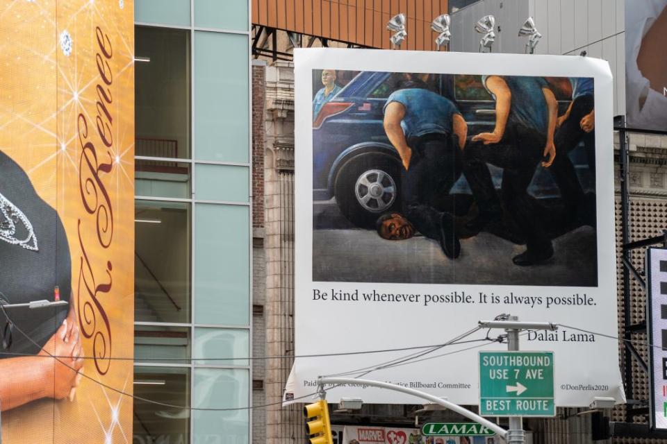 A billboard illustrating the killing of George Floyd hangs in Times Square on November 1, 2020 in New York City. The artwork on the billboard was painted by Donald Perlis and includes a quote by the Dalai Lama which reads “Be kind whenever possible. It is always possible”. (Photo by David Dee Delgado/Getty Images)