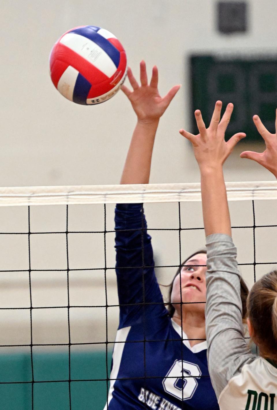 Alanna Schreibeis of Sandwich spikes the ball at Dennis-Yarmouth in volleyball.