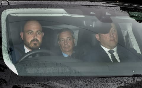 Nigel Farage in the back of a blacked out car, driving into Winfield House to meet President Trump - Credit: &nbsp;David Mirzoeff/PA