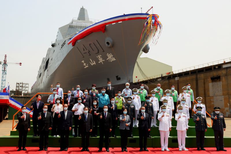 Taiwan's President Tsai Ing-wen poses for a group photo in front of Taiwan Navy's domestically built amphibious transport dock "Yushan" during its launching ceremony in Kaohsiung