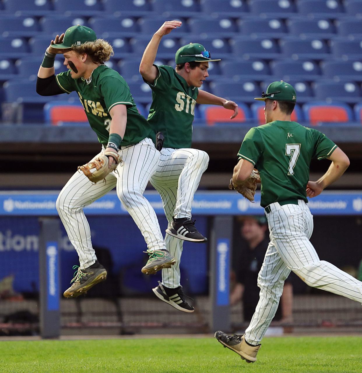 STVM's Devon Lehman celebrates with teammates at the end of the fifth inning of a baseball game against Hoban at Canal Park, Friday, May 12, 2023, in Akron, Ohio.